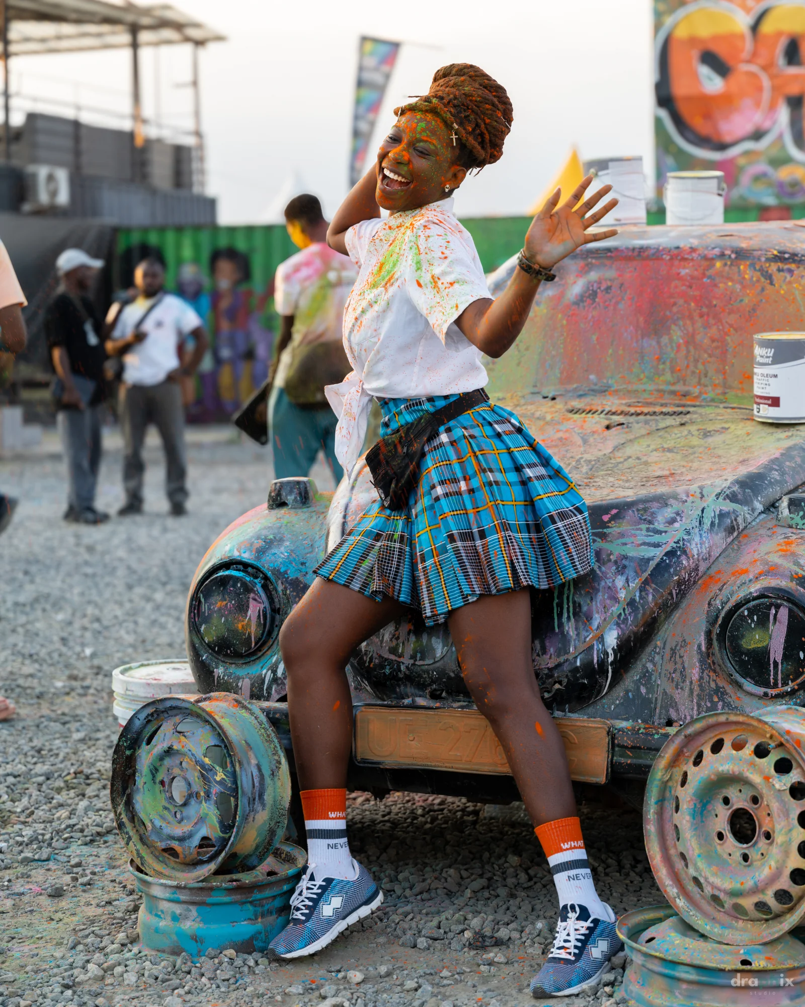 Festival portrait beside the art car