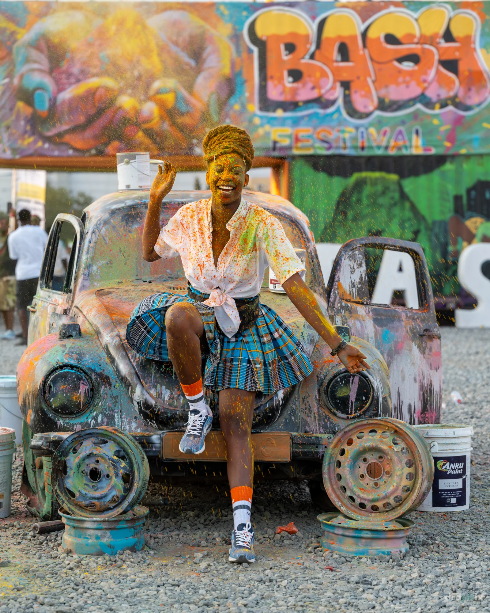 Seated portrait by the Calabash mural