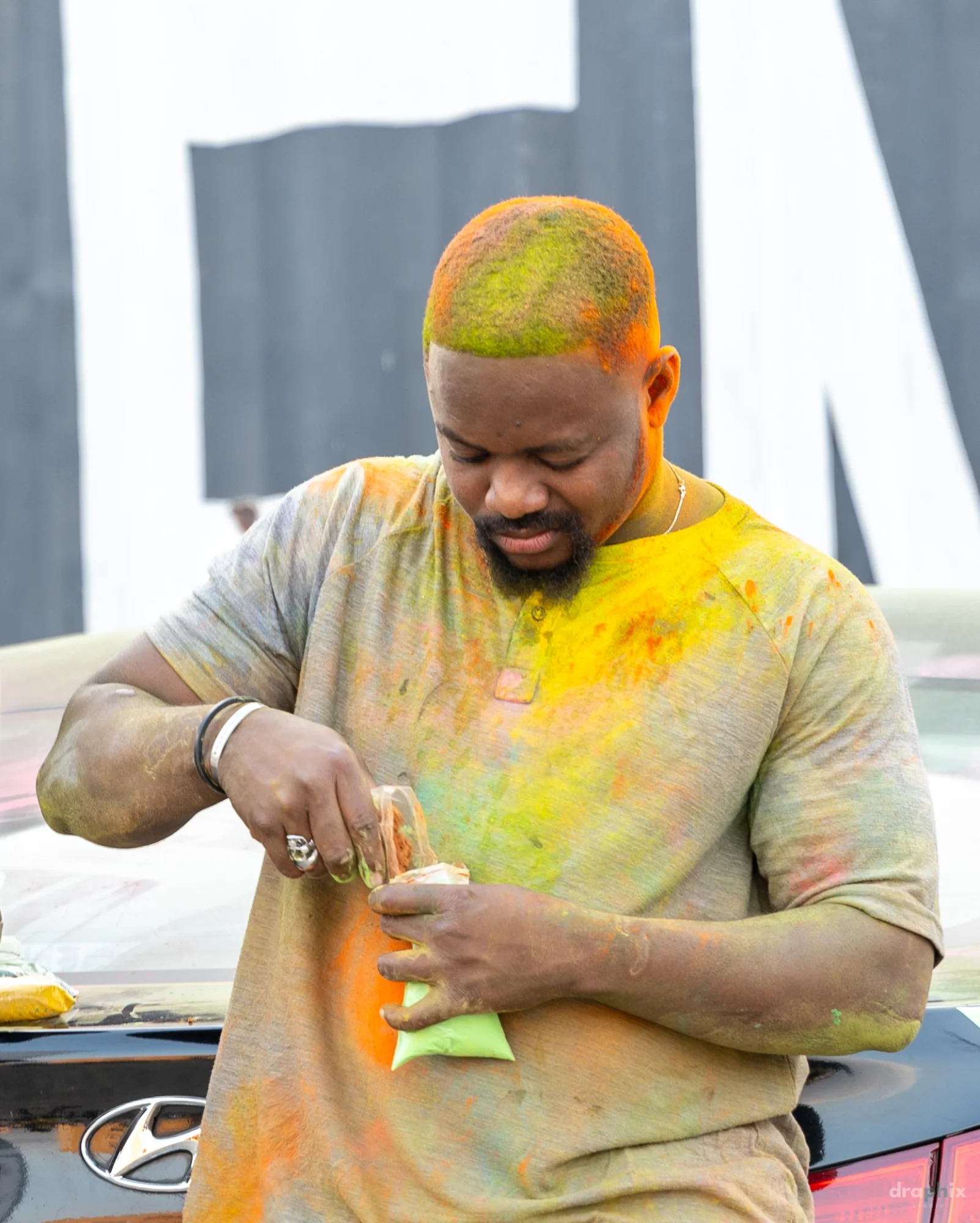 Man holding color powder