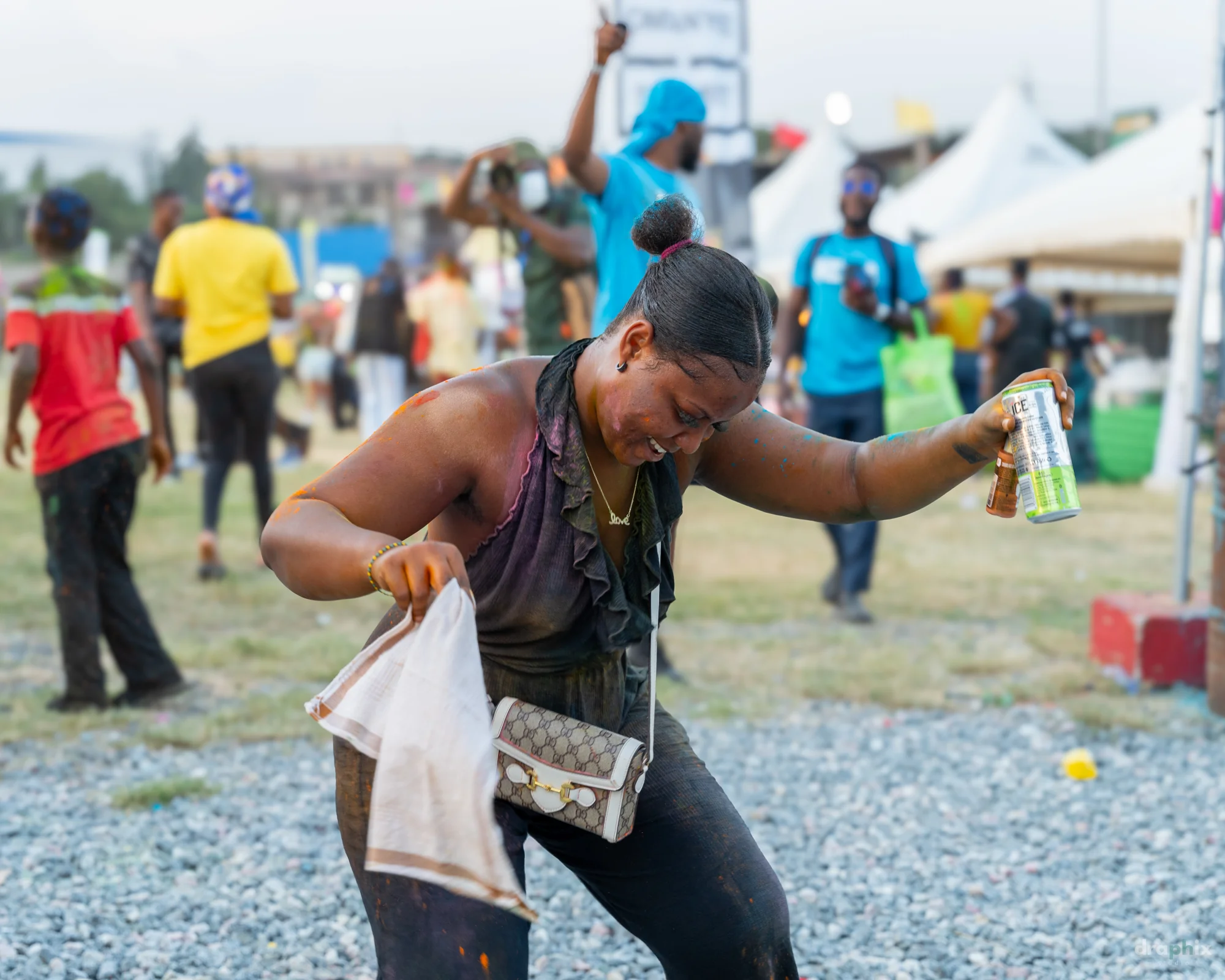 Dancer spraying color powder