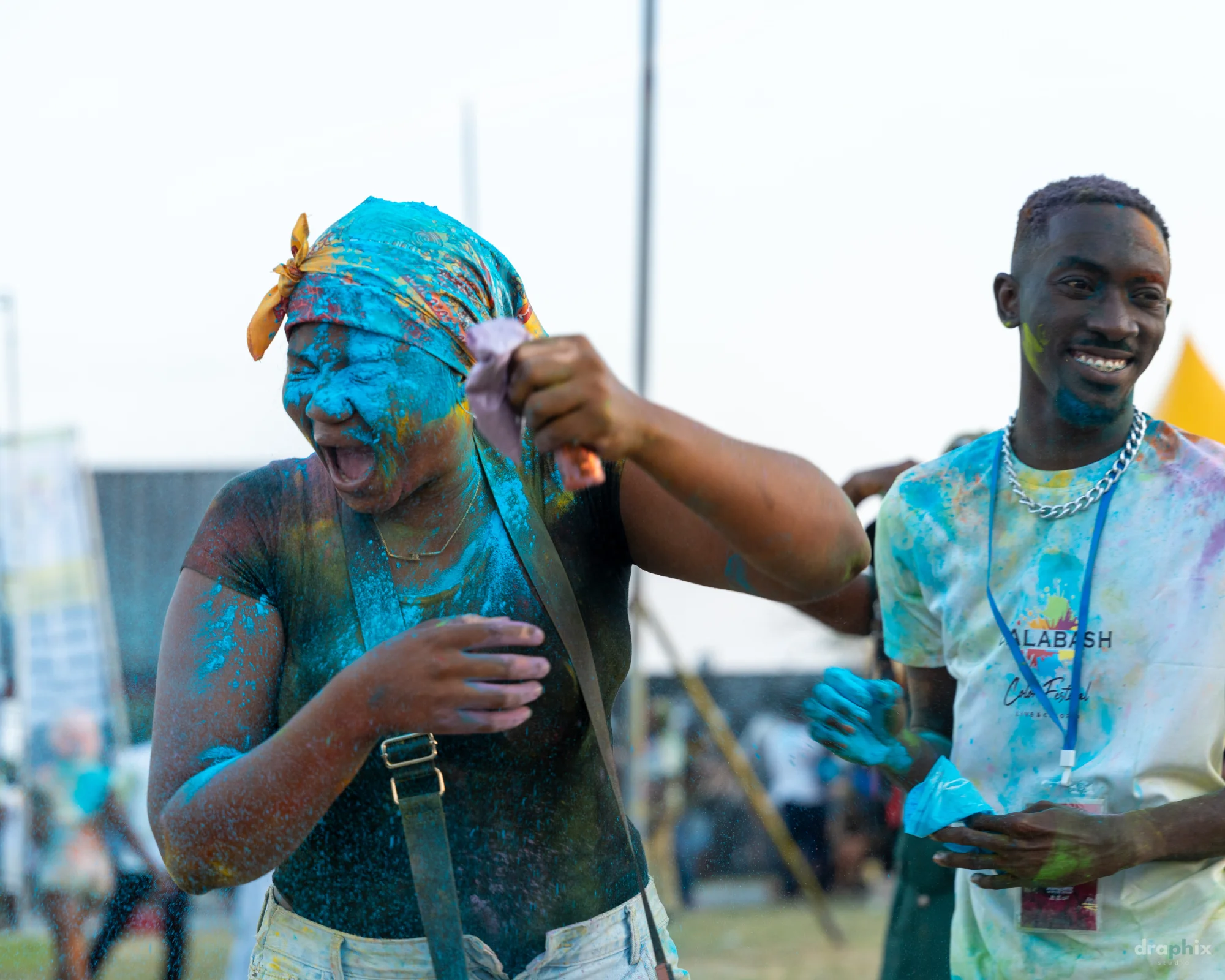 Friends covered in blue powder