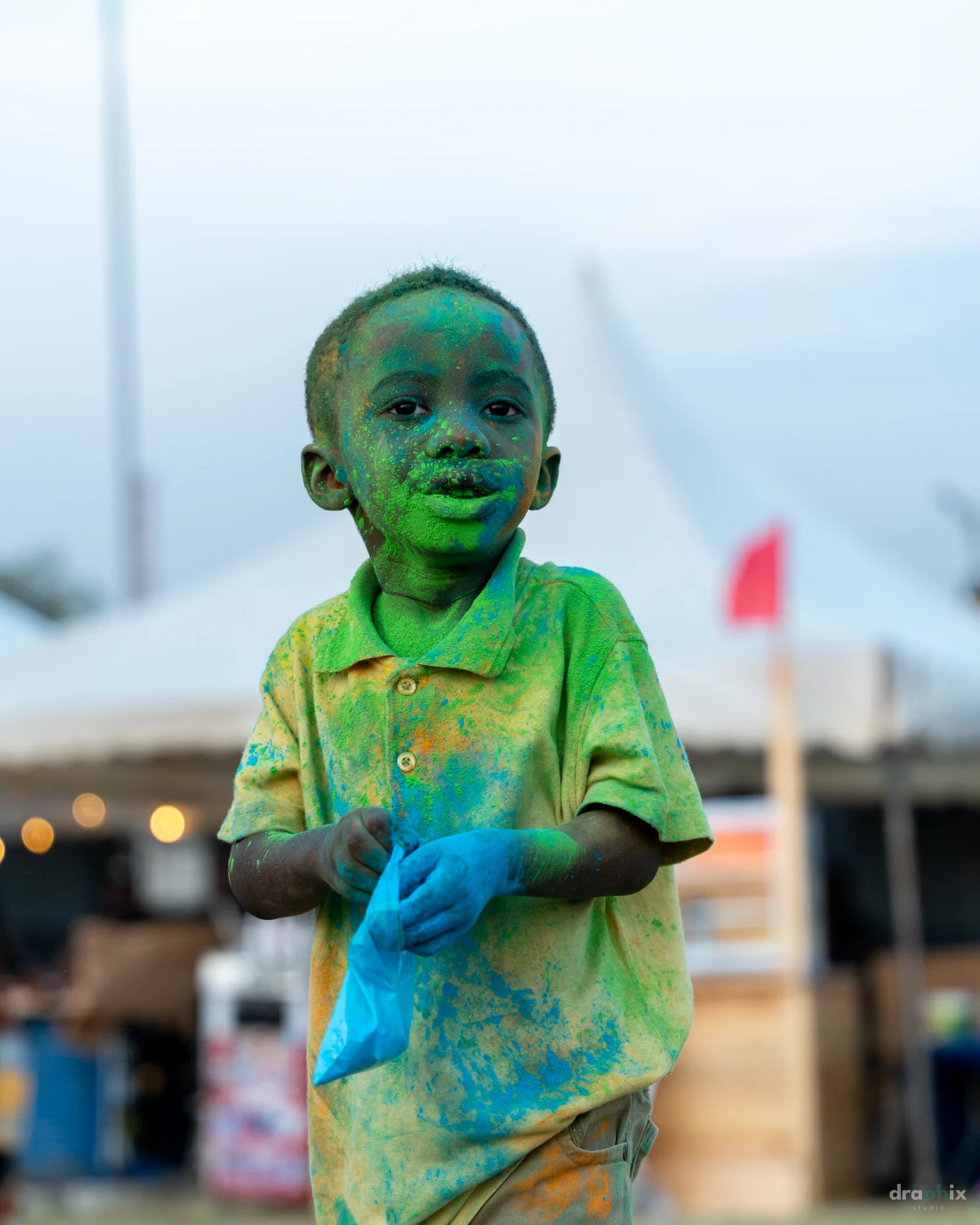 Child covered in green powder