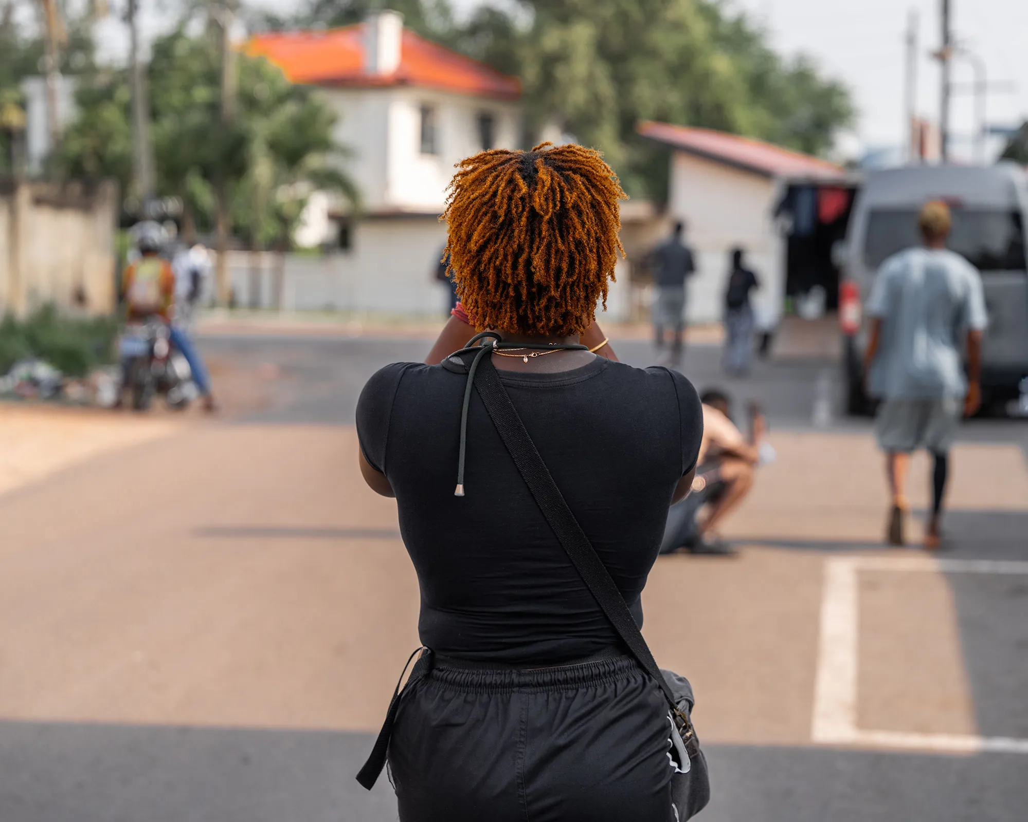 Woman facing a city street